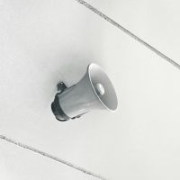 gray megaphone on white surface